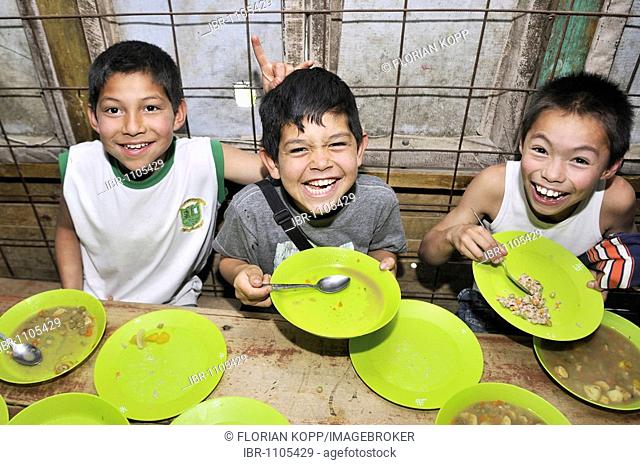 Children in a soup kitchen, slums of Alto de Cazuca, Soacha, Bogotá, Columbia