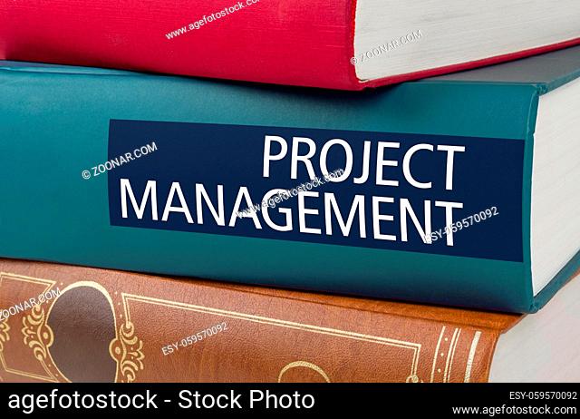 A book with the title Project Management written on the spine