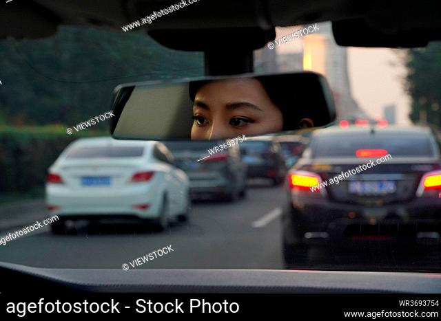 Driving in the rearview mirror of young women