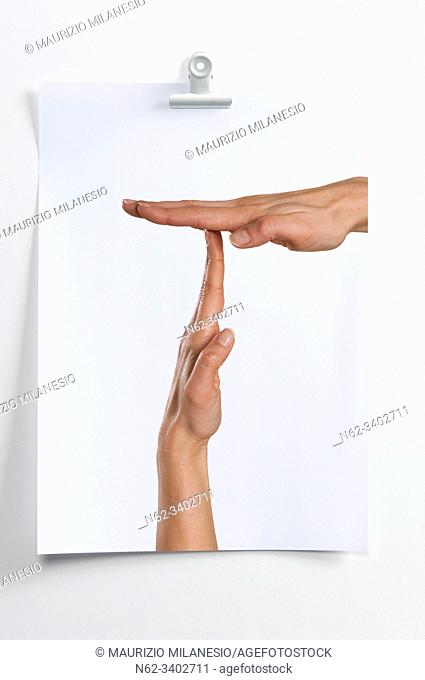 Blank sheet hanging on the wall with image of hands indicating break time