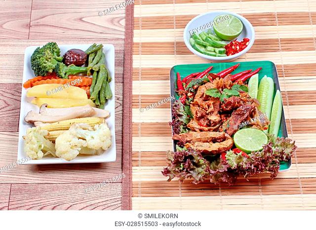 Spicy and sour mixed herb salad with fried stir taro in tofu sheet and fried mixed vegetables served with side dish are food for Vegetable festival of Chinese...