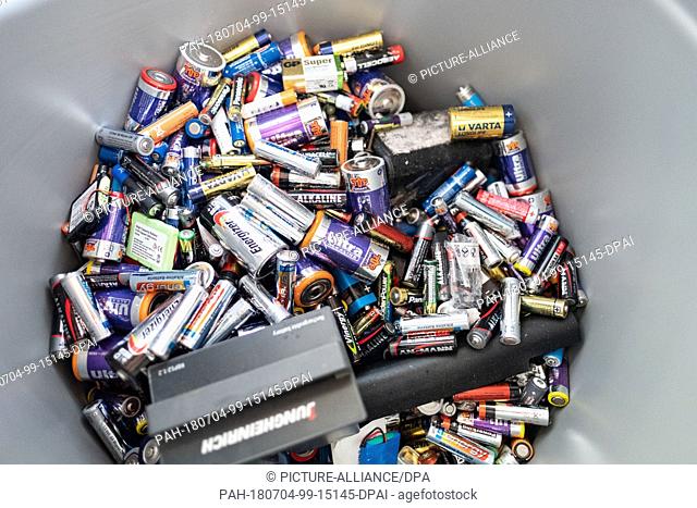 19 June 2018, Hanover, Germany: Batteries are in a disposal bin at a recycling center in Hanover. Whether button cell from the hearing aid or alkaline-manganese...
