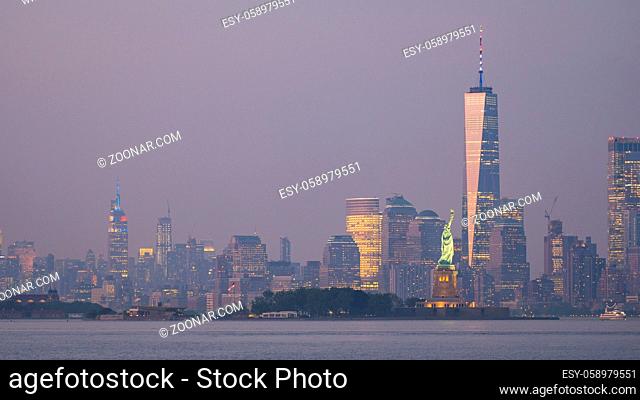 After dusk glow as lights come up in the city across the Hudson Bay in New York
