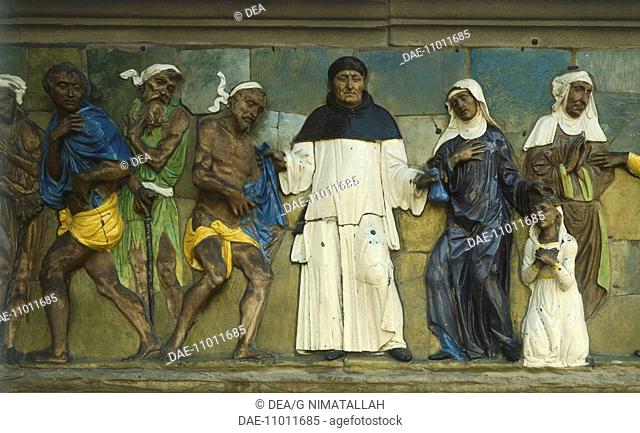Clothe the naked and provide for widows and orphans, scene from the Seven Works of Mercy, 1585, by Santi Buglioni (1494-1576), glazed terracotta frieze