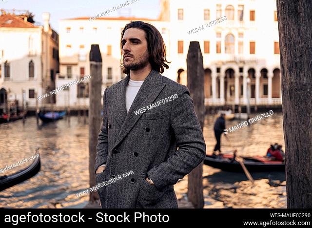Young man at the Canal Grande in Venice, Italy