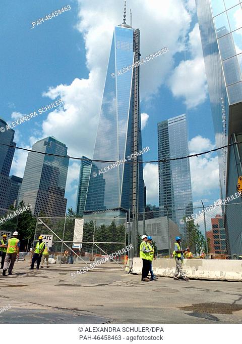 Construction workers are pictured in front of the One World Trade Center in New York City, USA, 20 August 2013. The skyscraper is built since 2006 at Ground...