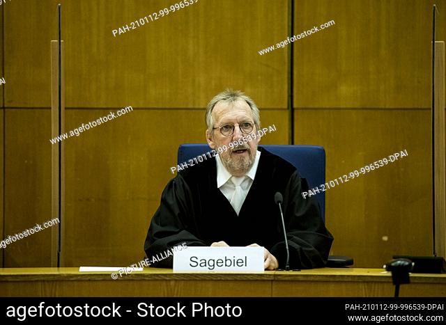 12 January 2021, Hessen, Frankfurt/Main: Presiding Judge Thomas Sagebiel sits in his seat in a courtroom at the Higher Regional Court at the start of another...