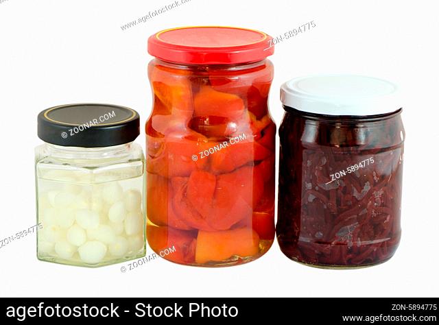 glass jar of pickled garlic red pepper and beetroot isolated on white background