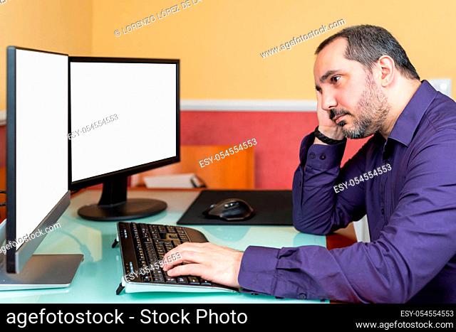 bored man using computer. Telework concept