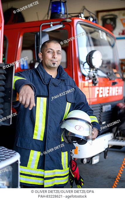 Fire brigade apprentice Nidal Almatar posing at the fire brigade in Orscholz, Germany, 24 August 2016. The 36-year-old Syrian has been a member of the voluntary...