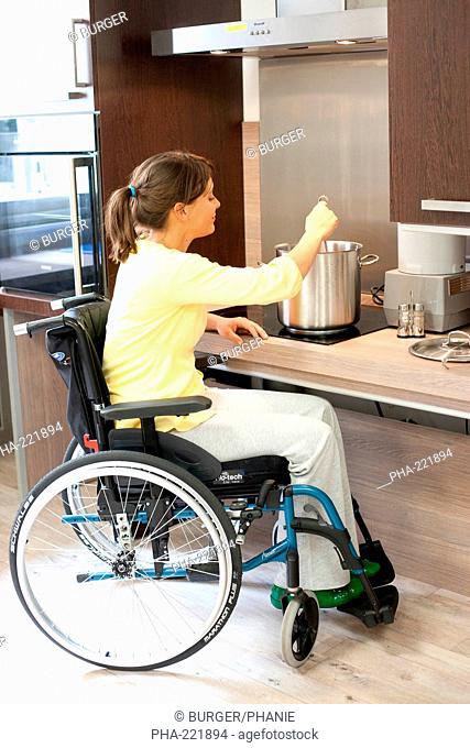 Disabled person in a Habitat Laboratory Handicap L2H, life experimental set up in the service of Physical Medicine and Rehabilitation, Limoges hospital, France