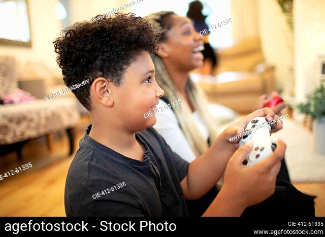 Mother and son playing video game
