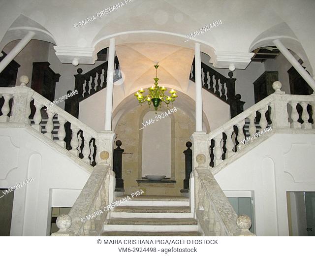 A beautiful symmetrical double staircase in an old building in the Castello district in Cagliari, Sardinia, Italy