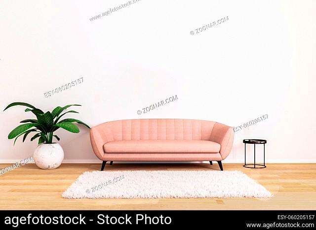 Pink sofa with black coffee table and plant in bright living room with white wall and wooden floor. Living room for mockup. Bright living room
