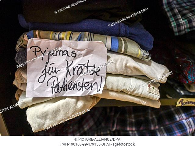 08 January 2019, Berlin: Pyjamas reserved for scabies patients are lying in the clothing store of the Berlin City Mission in Lehrter Strasse