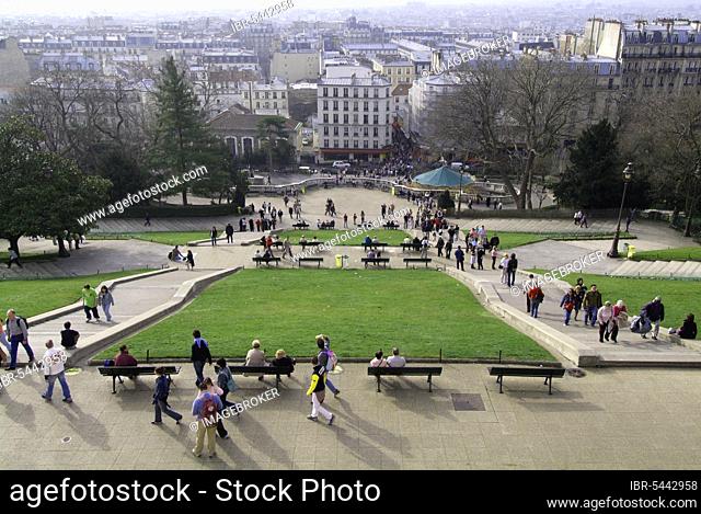 Tourists in the park near the Sacre Coeur Basilica, view of the city, Paris, France, Europe