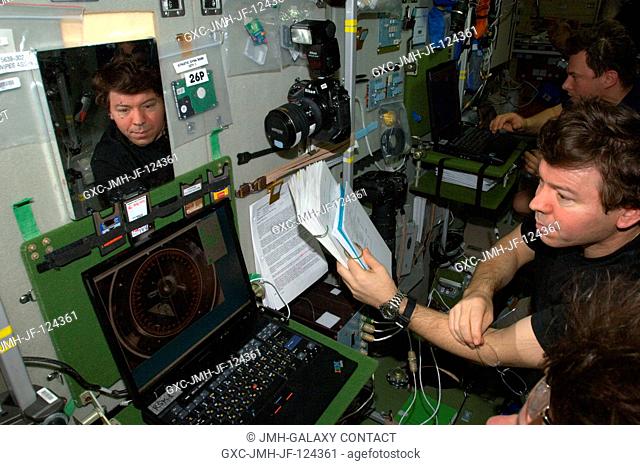 NASA astronaut Michael Barratt, Expedition 20 flight engineer, uses an onboard laptop-based simulator in the Zvezda Service Module of the International Space...