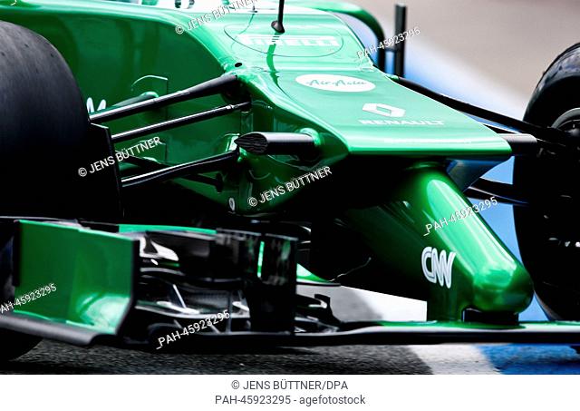 Swedish Formula One driver Marcus Ericsson of Caterham steers his the new car CT05 through the pit lane during the training session for the upcoming Formula One...