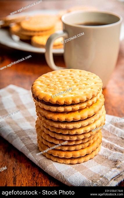 Sweet sandwich cookies on checkered napkin