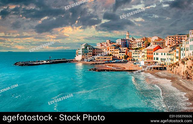 Ancient picturesque italian town ancient fishing village of Bogliasco during overcast sunset over cloudy sky background. Turquoise bay of Mediterranean Sea...