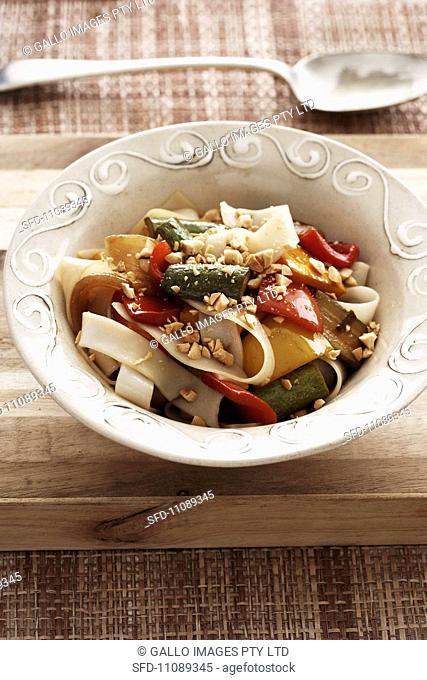 Tagliatelle with sweet and sour vegetables and peanuts