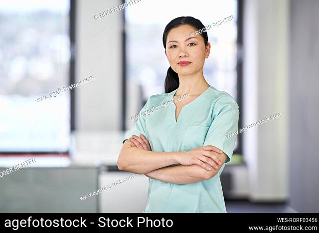 Portrait of confident nurse in scrubs