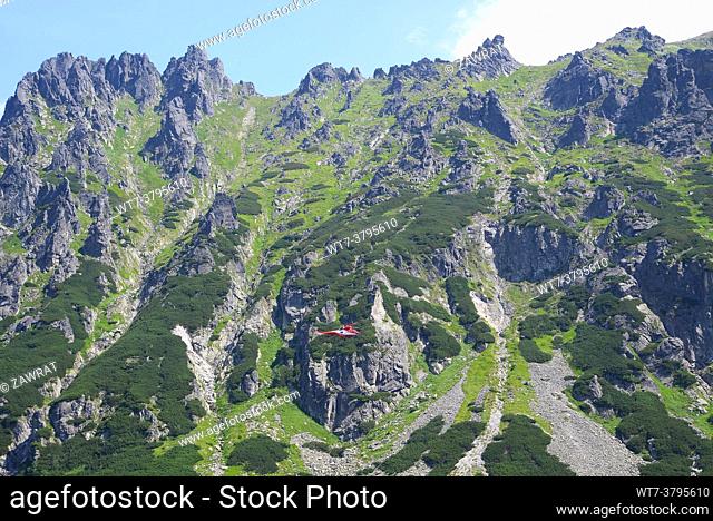 Rescue helikopter, red-white helikopter, rescue action in the High Tatras ,