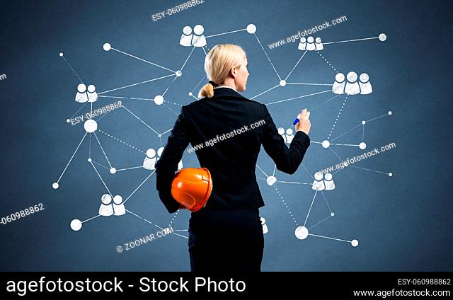 Businesswoman designing social network interaction structure. HR specialist in business suit with safety helmet. Recruitment agency presentation