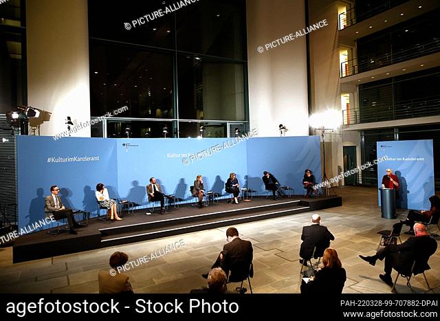 28 March 2022, Berlin: Claudia Roth (r, Bündnis 90/Die Grünen), Minister of State for Culture and Media, gives a closing speech to Chancellor Olaf Scholz (3rd...