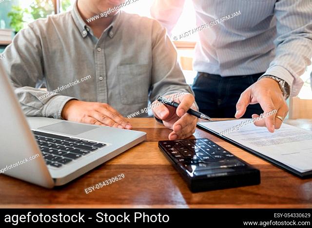Administrator business man financial inspector and secretary making report, calculating or checking balance. Internal Revenue Service inspector checking...