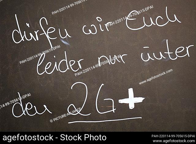 14 January 2022, Saxony, Dresden: A sign outside a cafe points out the 2G-plus rule. Saxony is relaxing its strict Corona protection measures from this Friday