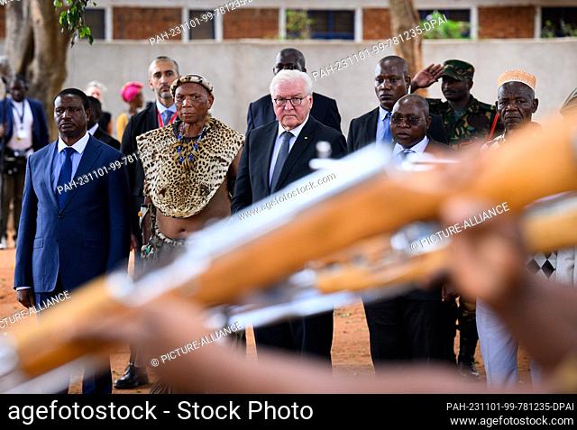 01 November 2023, Tanzania, Songea: German President Frank-Walter Steinmeier lays a wreath at the memorial in Songea's Memorial Park together with descendants...