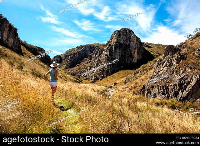 Female exploring and admiring the Snowy Mountains High Plains and gorges in NSW Australia