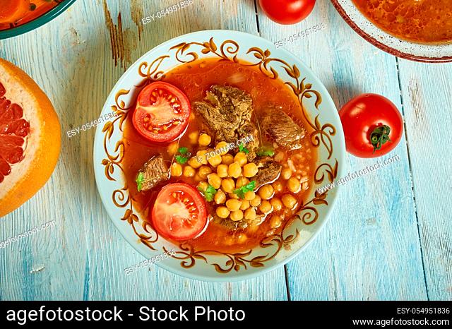 Algerian berkoukes soup ich north african spiced, tomato based , african cuisine, Traditional assorted Mediterranean dishes, Top view