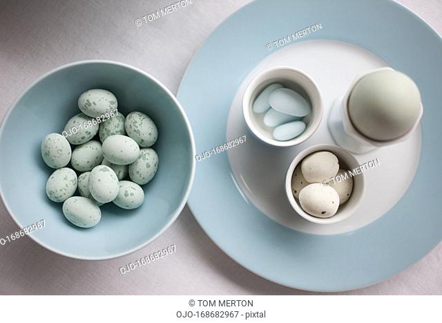 Speckled blue candy eggs in bowl