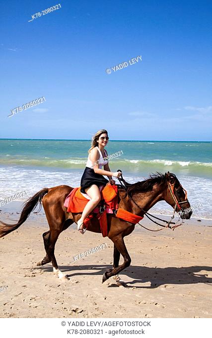 Horse riding on the beach, Cumbuco, Fortaleza district, Brazil