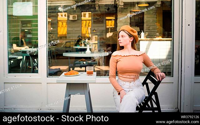 young woman, serious, cafe, fashionable