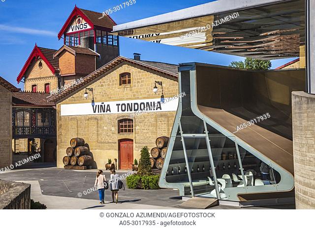 Lopez de Heredia Wine Cellar. Viña Tondonia. In the foreground, design by Zaha Hadid. In the background, Traditional modernist wine cellar. Haro
