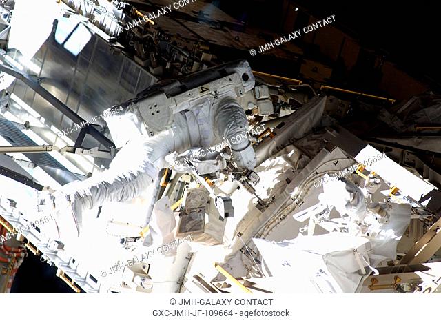 Astronaut Steve Bowen, STS-126 mission specialist, participates in the mission's third scheduled session of extravehicular activity (EVA) as construction and...