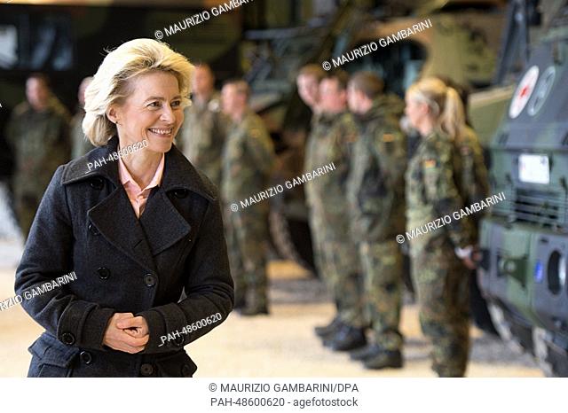German Defence Minister Ursula von der Leyen looks at equipment of the Operational Reserve Force as she meets soldiers at Camp Prizren in Kosovo, 15 May 2014