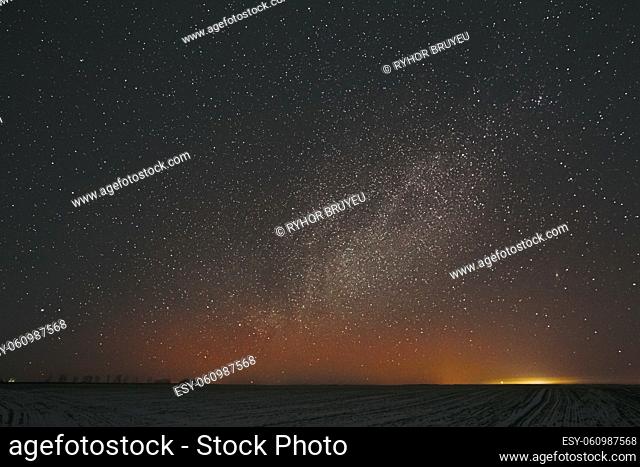 Real Night Sky Stars Background With Natural Colourful Sky Gradient. Sunset, Sunrise Light And Starry Sky. Yellow And Black Colors Over Horizon