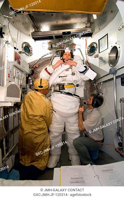 European Space Agency (ESA) astronaut Thomas Reiter, Expedition 14 flight engineer, participates in an Extravehicular Mobility Unit (EMU) spacesuit fit check in...