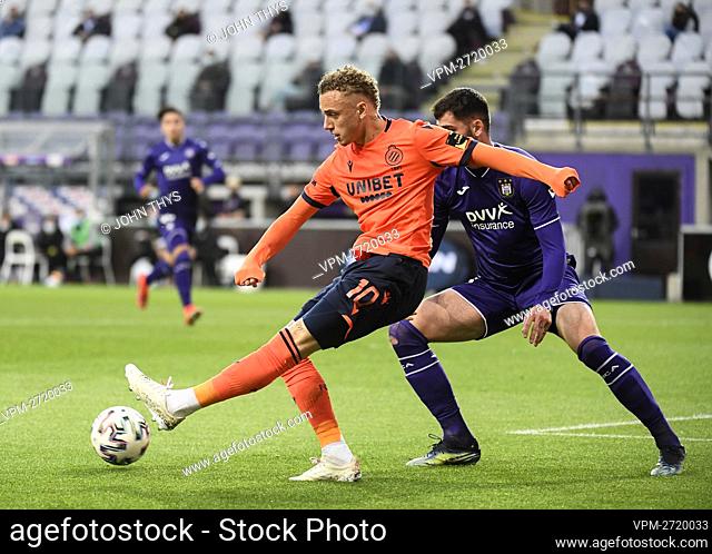 Club's Noa Lang and Anderlecht's Elias Cobbaut fight for the ball during a soccer match between RSC Anderlecht and Club Brugge KV