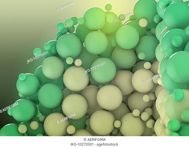 Close up of different sized green balls