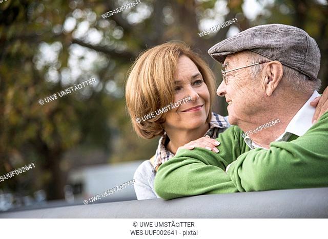 Confident senior man with daughter outdoors
