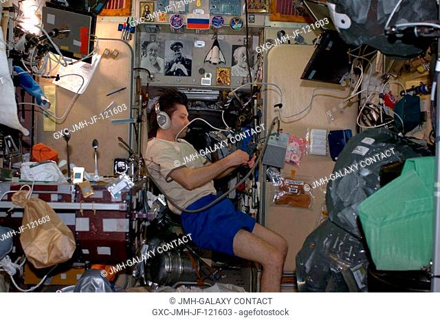 Russian Federal Space Agency cosmonaut Oleg Kononenko, Expedition 17 flight engineer, uses a communication system in the Zvezda Service Module of the...