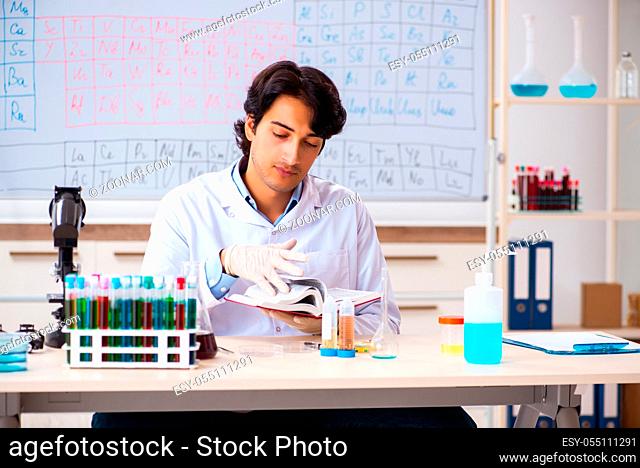 Young chemist working in the lab