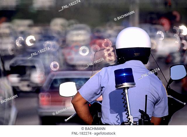 Policeman riding motorcycle