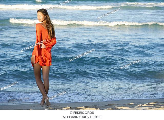 Young woman standing on beach