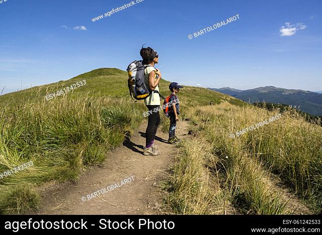 hikers on Carynska polonina ridge, Bieszczady National Park, UNESCO Reserve called Eastern Carpathian Biosphere Reserve, Lesser Poland Voivodeship, Carpathians
